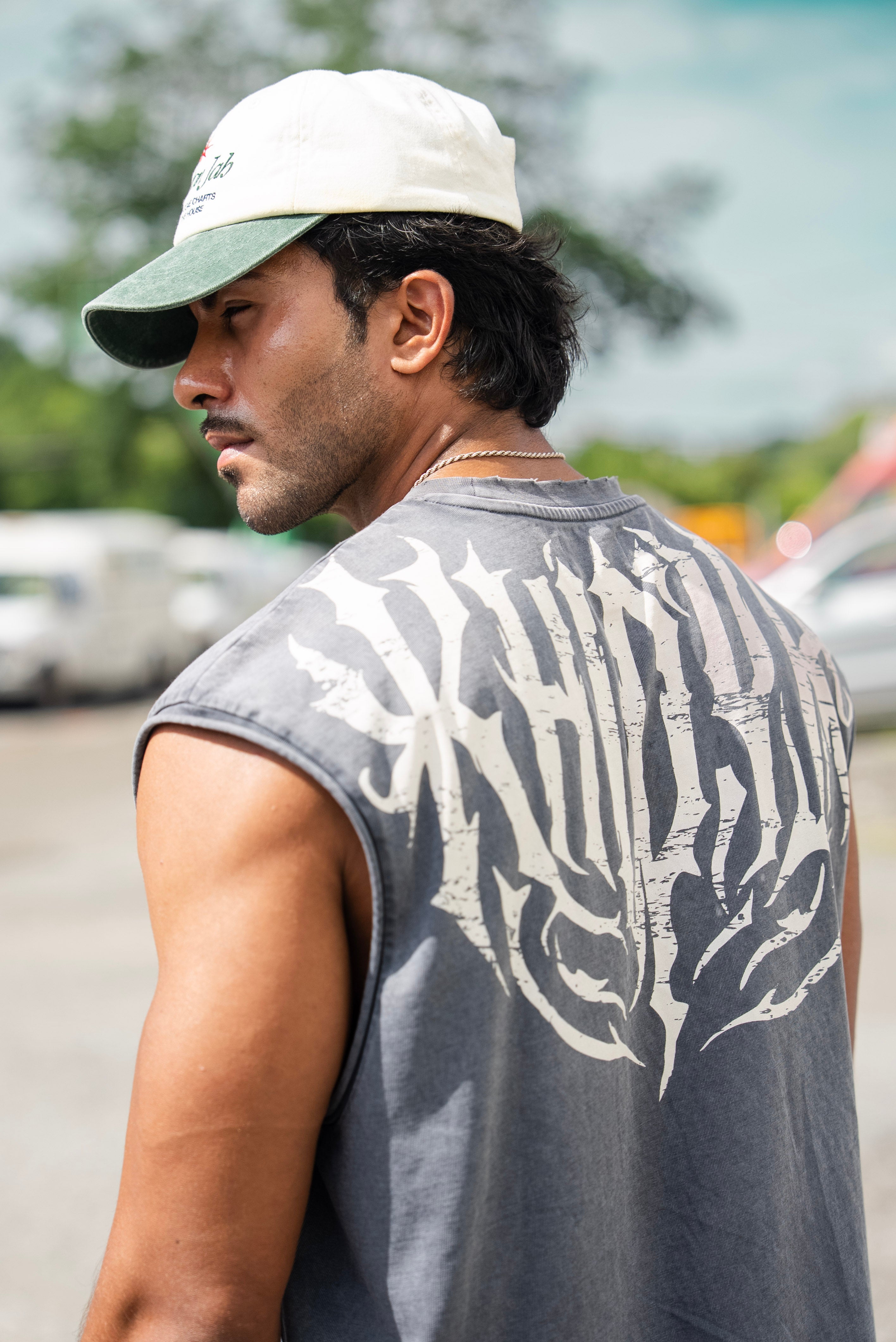 Shadow Cropped Tank in Acid Wash on model, close back view of the shoulder and back print