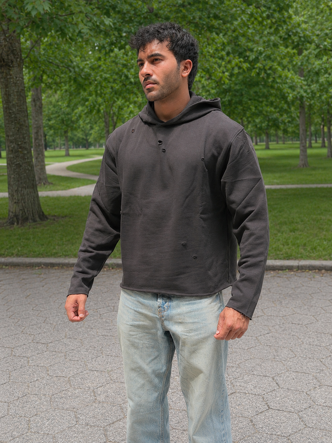 Stealth Pump-Cover Hoodie in Black on model — front fit