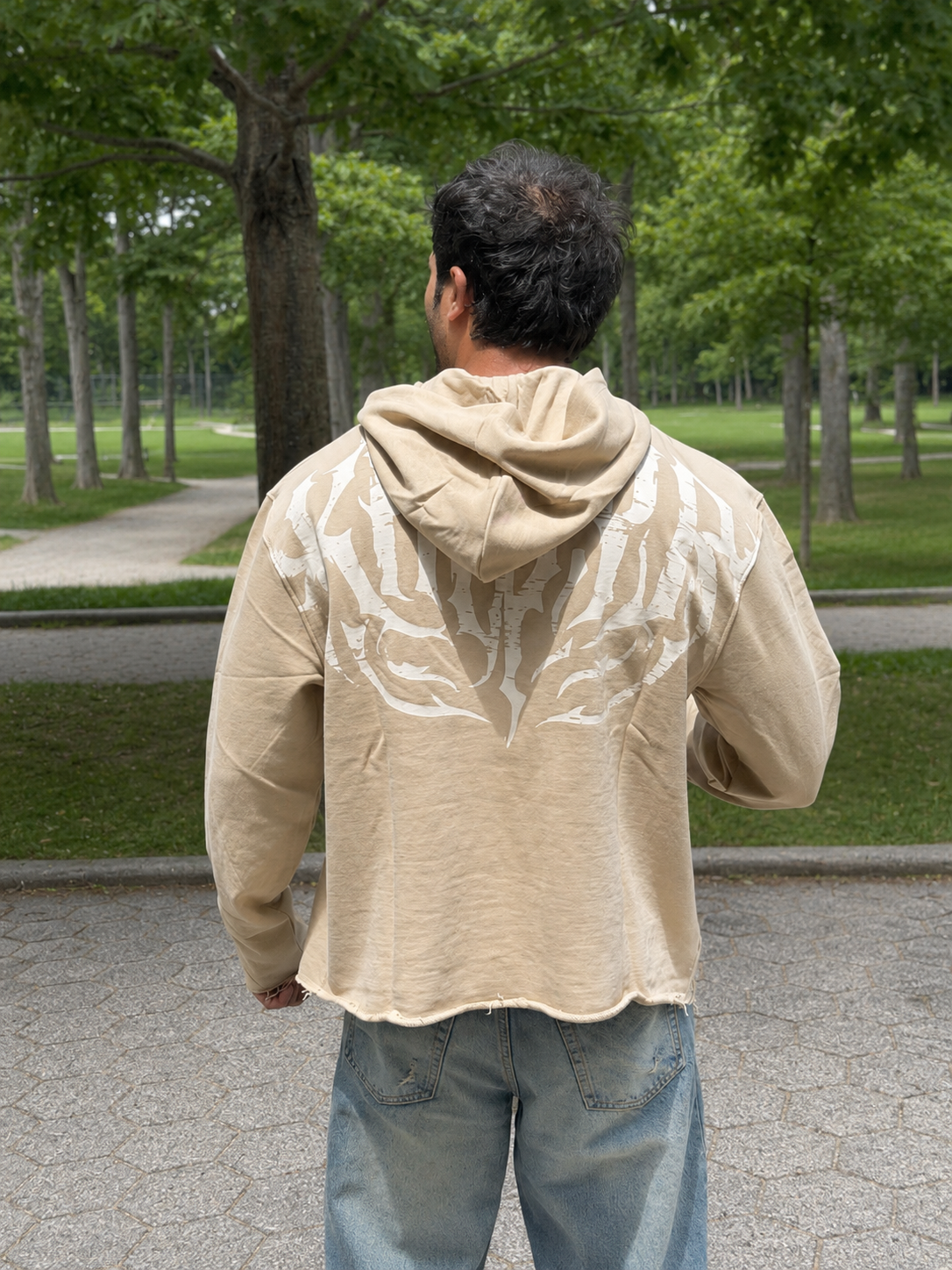 Stealth Pump-Cover Hoodie in Beige on model — back