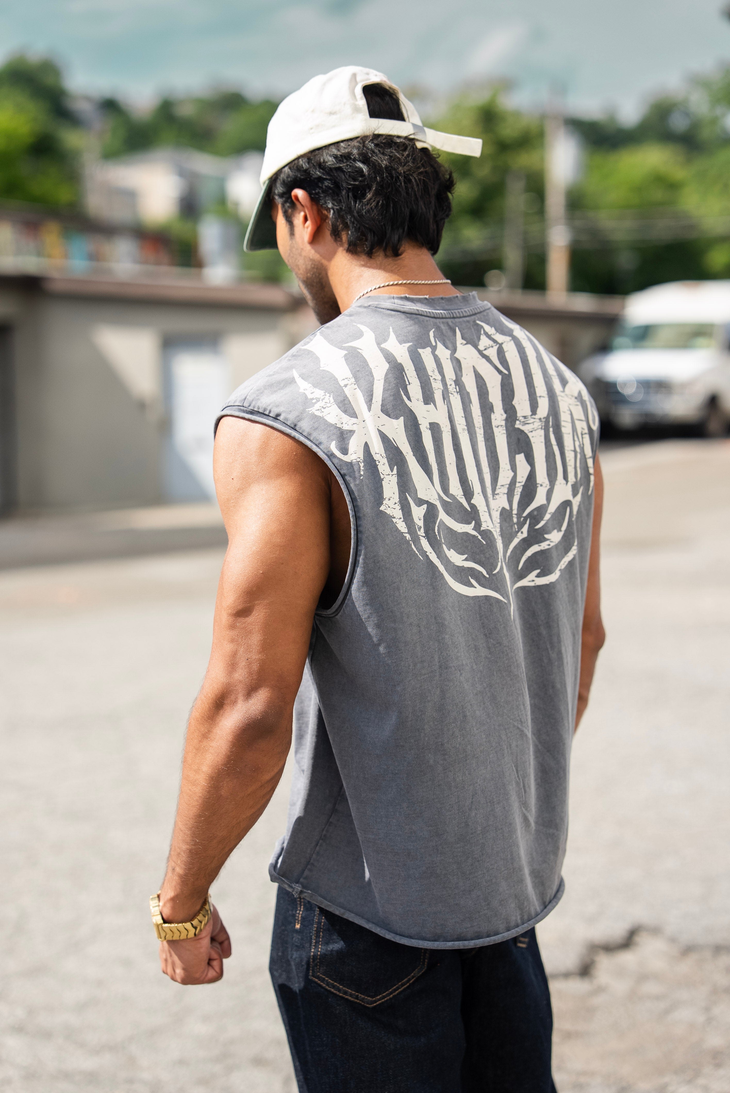 Shadow Cropped Tank in Acid Wash on model, back view showing the KHIDYR back print