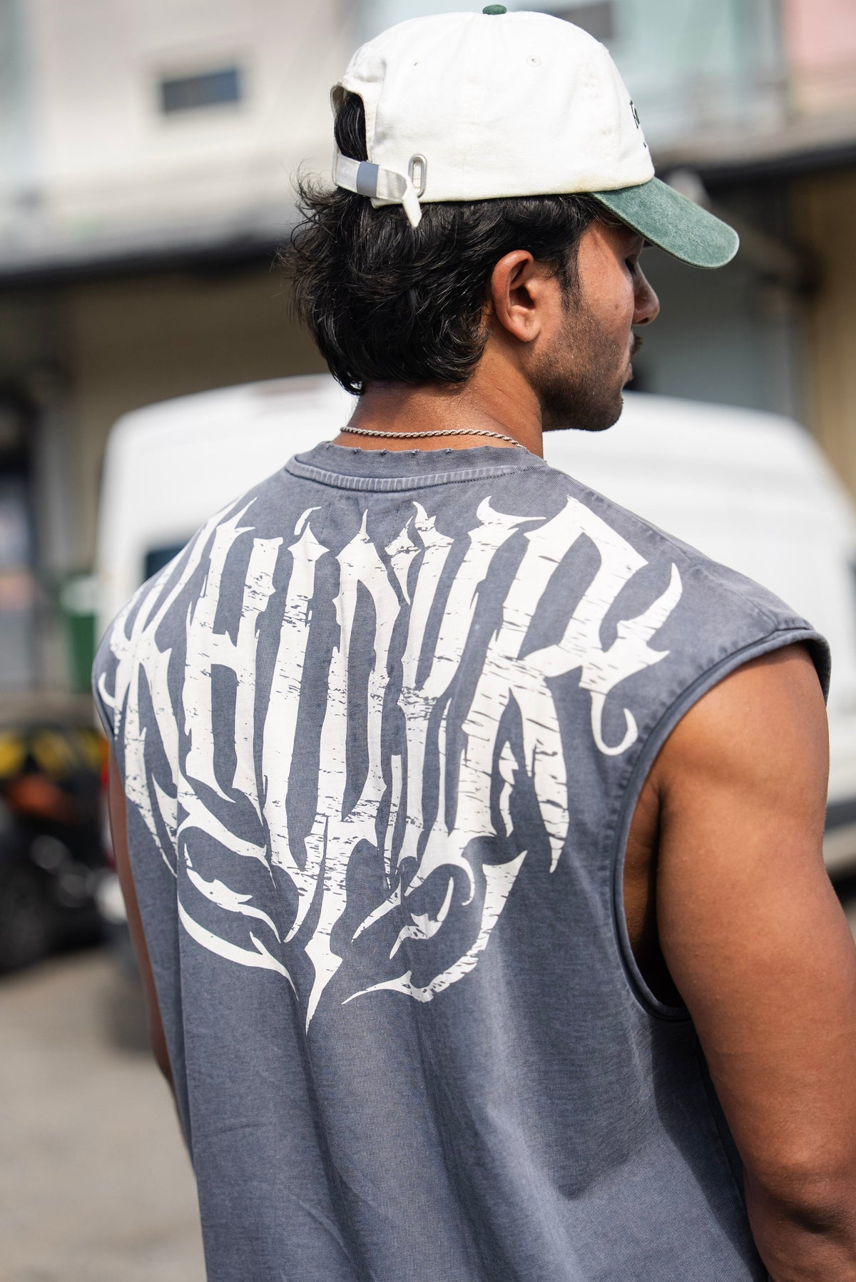 Shadow Cropped Tank in Acid Wash on model, close-up of the gothic KHIDYR back print