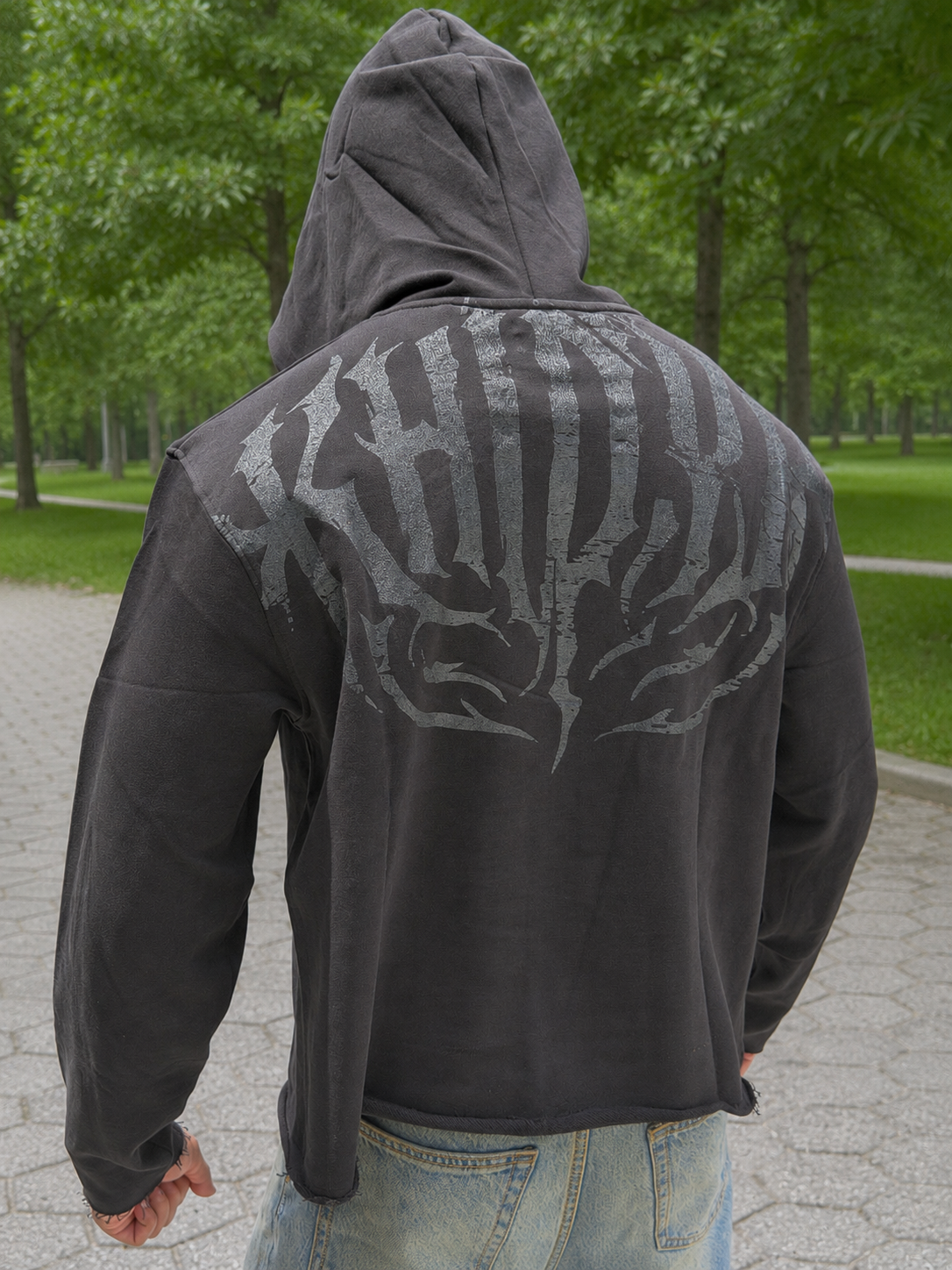 Stealth Pump-Cover Hoodie in Black on model — hood up, back print